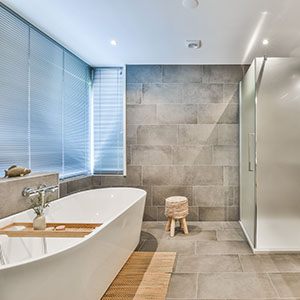 Alexander Fine Design Construction Remodeling - Newly Renovated Bathroom with modern bathtub and shower